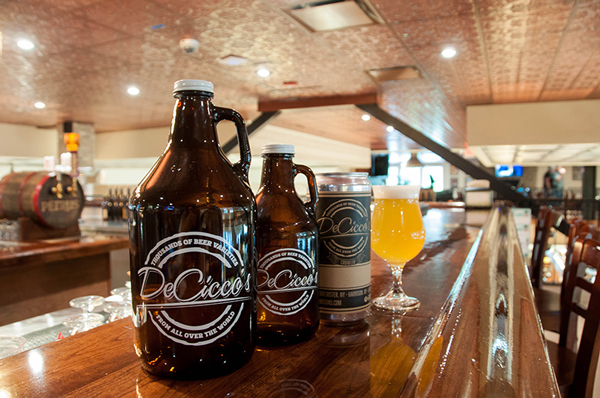Growlers and a glass of DeCicco & Sons beer