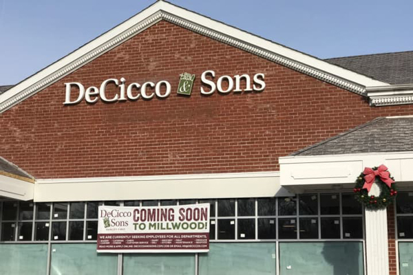 Coming soon sign on the front of the DeCicco & Sons Millwood location